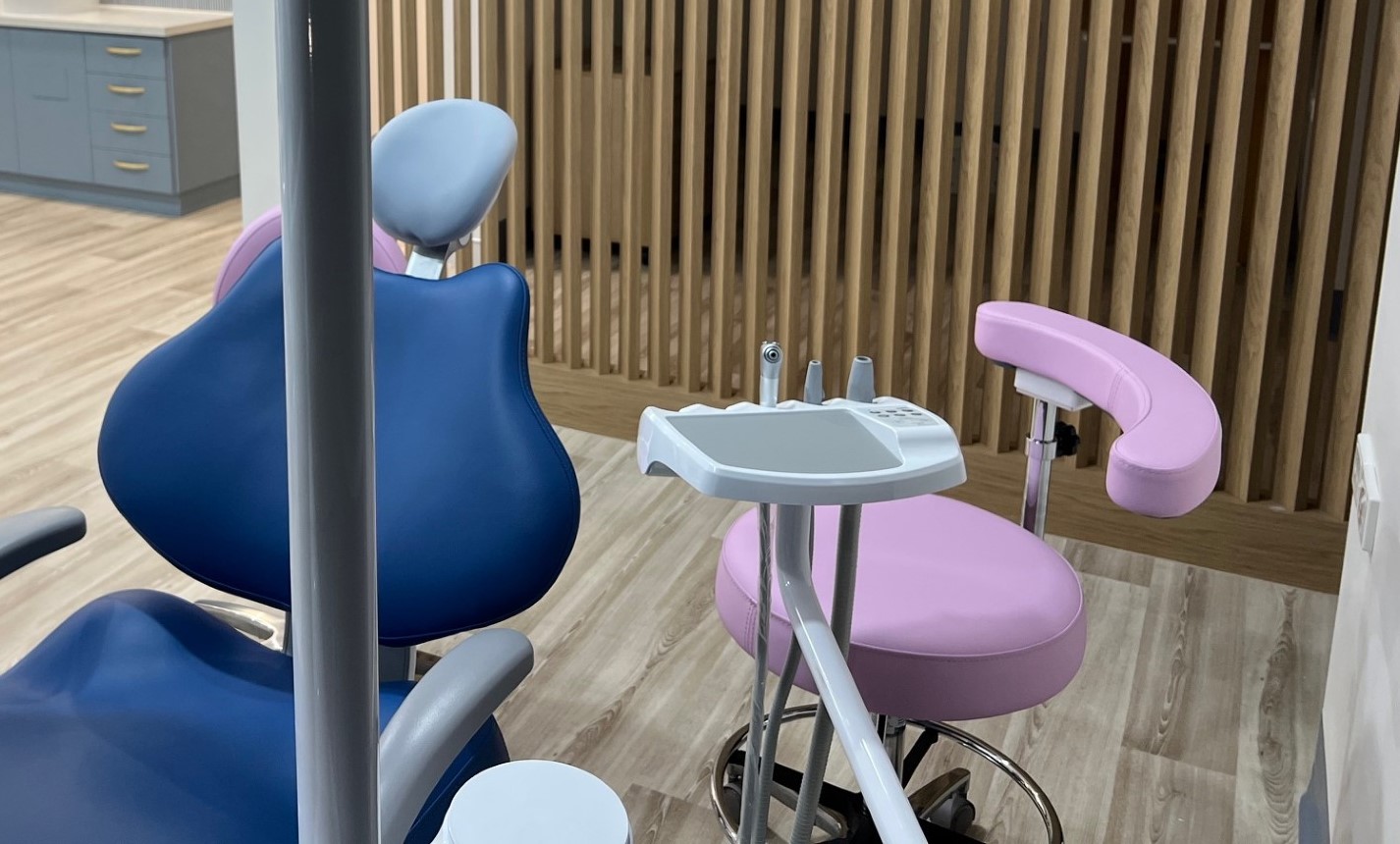 Little beautiful girl at the dentist smiling